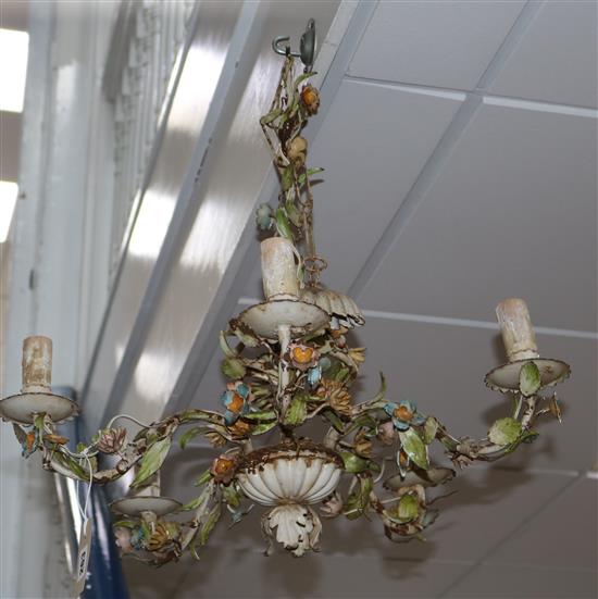 A polychrome wrought iron five light chandelier